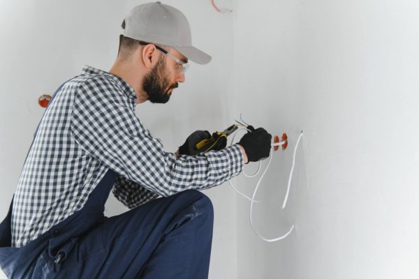 professional-electrician-working-on-a-home-electri-2025-03-14-18-28-51-utc-1536x1022